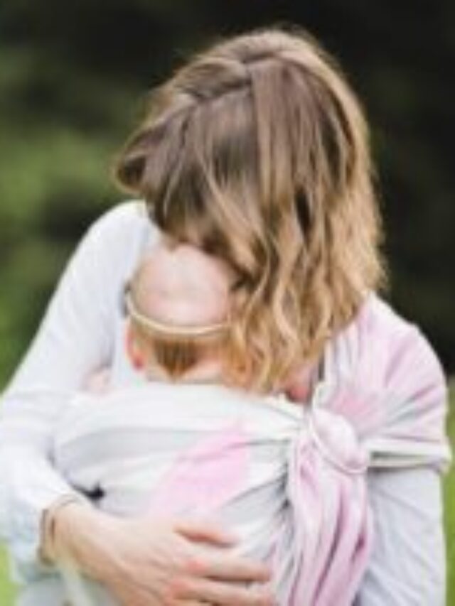 Beautiful,Young,Mother,With,Her,Infant,Baby,In,Ring,Sling