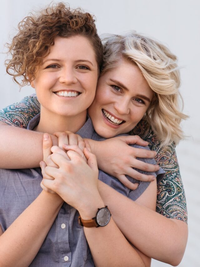 Portrait,Of,A,Smiling,Young,Lesbian,Couple,Hugging,Each,Other