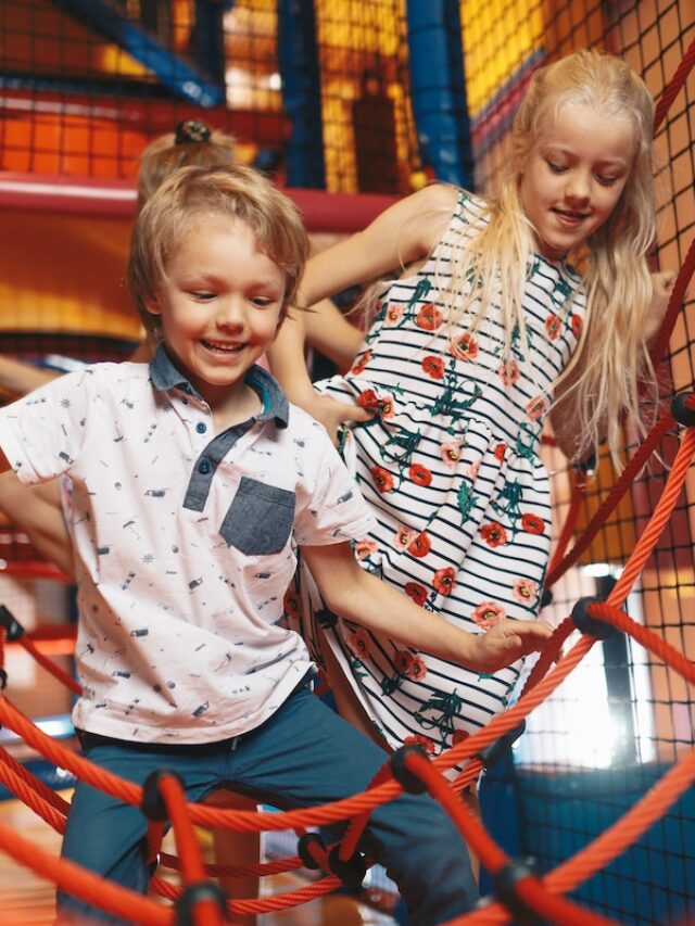 Happy,Group,Of,Siblings,Playing,Together,On,Indoor,Playground.,Excited