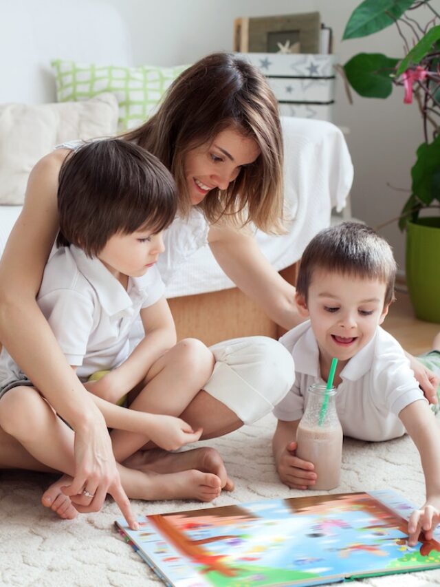 Young,Mother,,Read,A,Book,To,Her,Two,Children,,Boys,