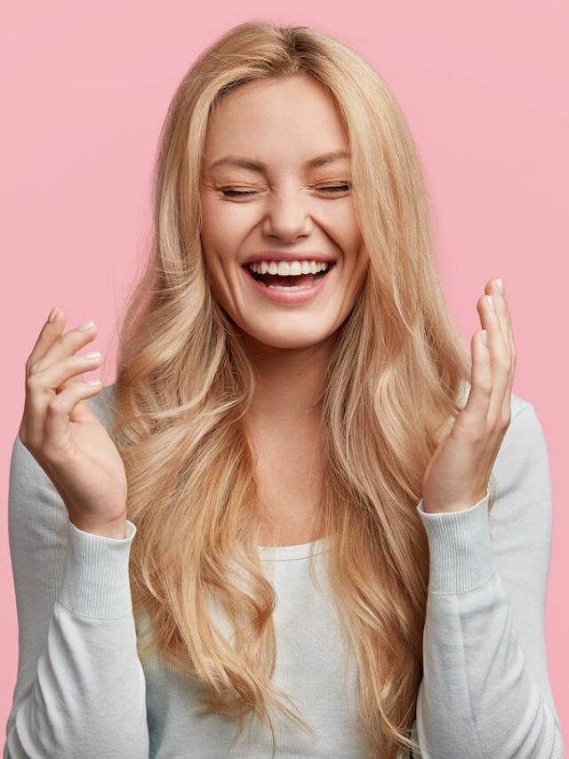 Isolated,Shot,Of,Joyful,Blonde,Young,Cute,Woman,Laughs,Joyfully