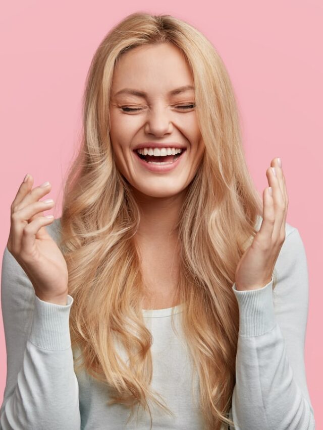 Isolated,Shot,Of,Joyful,Blonde,Young,Cute,Woman,Laughs,Joyfully