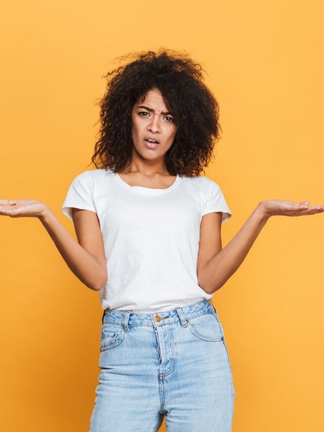 Portrait,Of,A,Confused,Young,African,Girl,Holding,Copy,Space