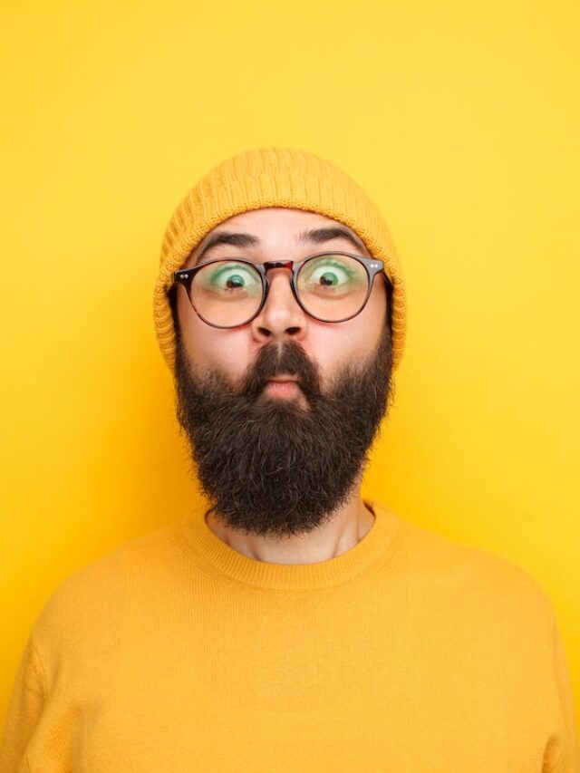 Bearded,Man,In,Yellow,Outfit,Doing,Fish,And,Looking,Expressively