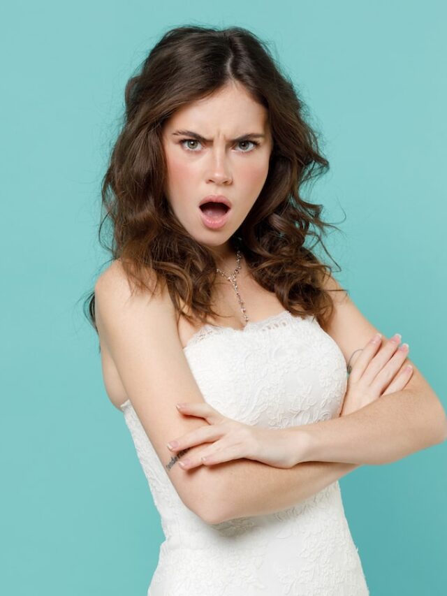 Shocked,Irritated,Bride,Young,Woman,20s,In,Beautiful,White,Wedding