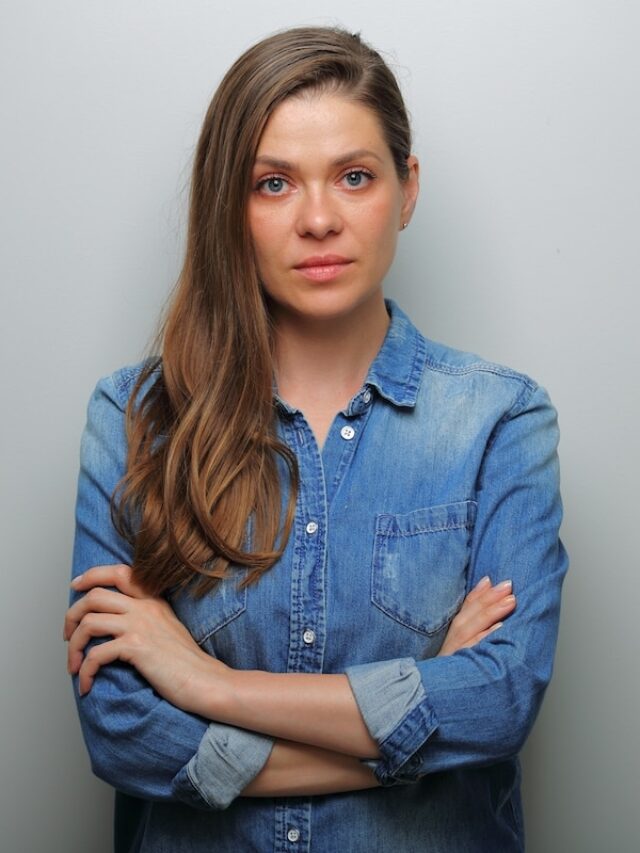 Serious,Woman,In,Blue,Casual,Denim,Shirt,With,Arms,Crossed.