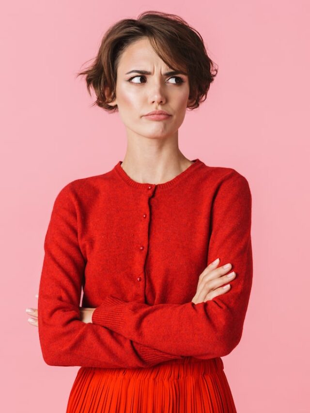 Portrait,Of,An,Upset,Beautiful,Young,Woman,Wearing,Red,Clothes