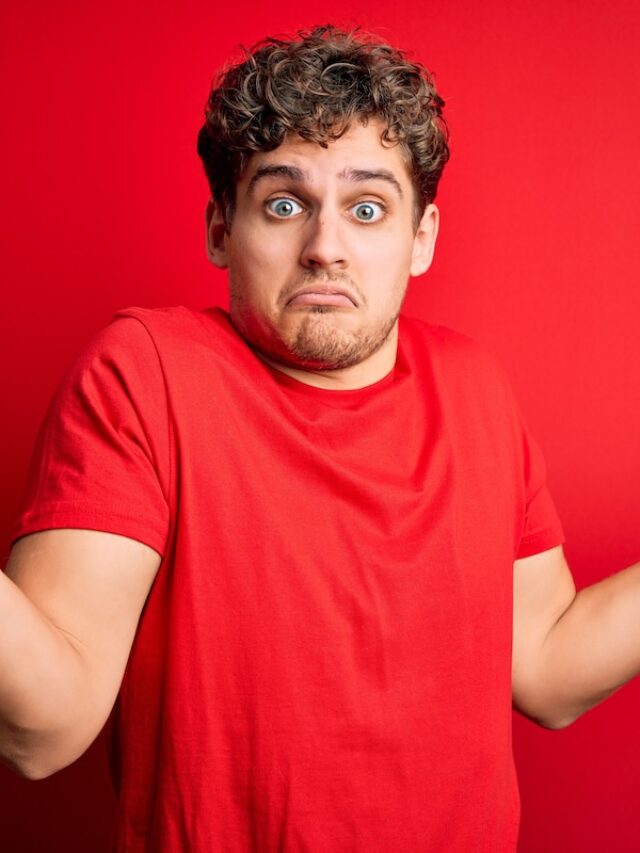 Young,Blond,Handsome,Man,With,Curly,Hair,Wearing,Casual,T-shirt