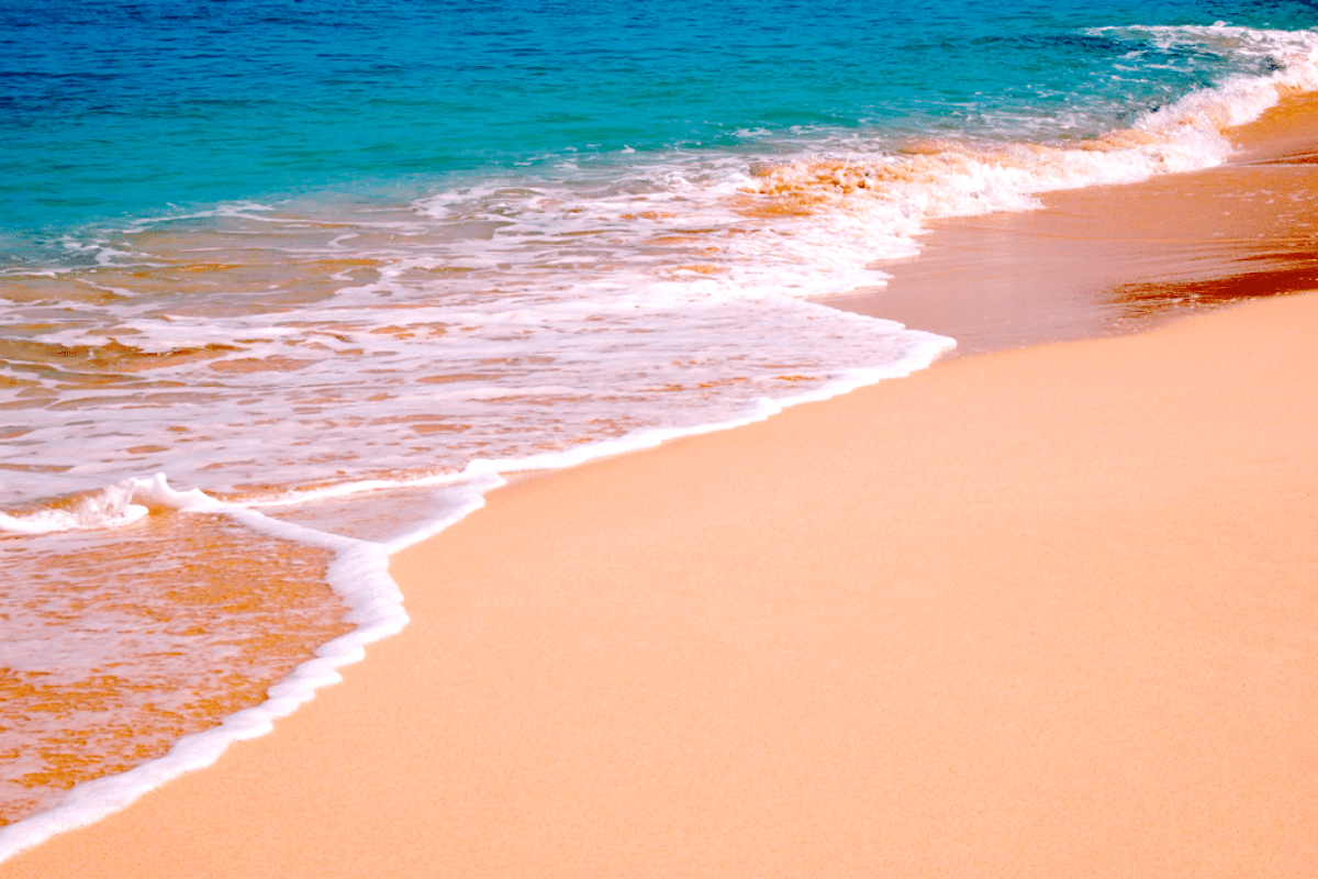 turquoise waves on pink sand beach, harbor Island, eluethera, bahamas